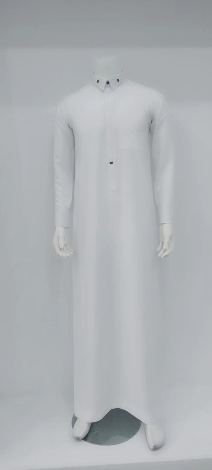 White thobe with dark collar-tip accents and concealed front placket